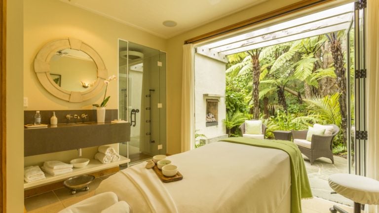 Image displaying a spa treatment room and natural outside vegetation at Kauri Cliffs Resort spa