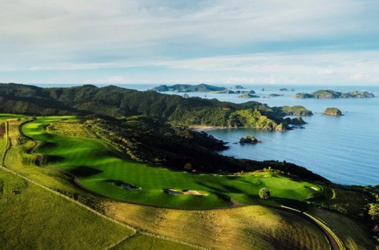 Aerial image of Kauri Cliffs Golf Course and nearby Bay of Islands in New Zealand