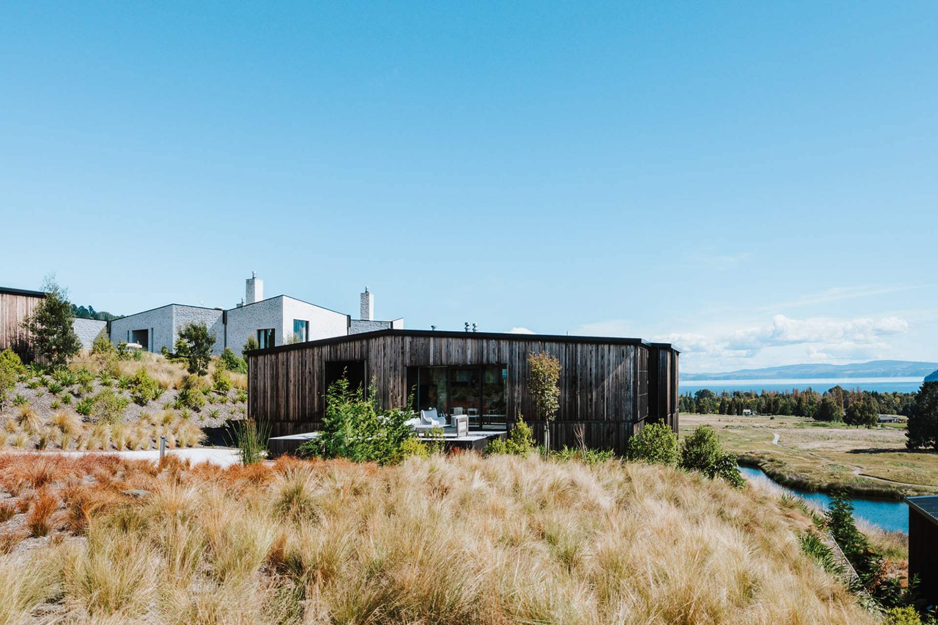 View of the Kinloch Club golf resort accommodation under a blue sky