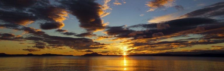 Landscape view of the setting sun over Lake Taupo, New Zealand