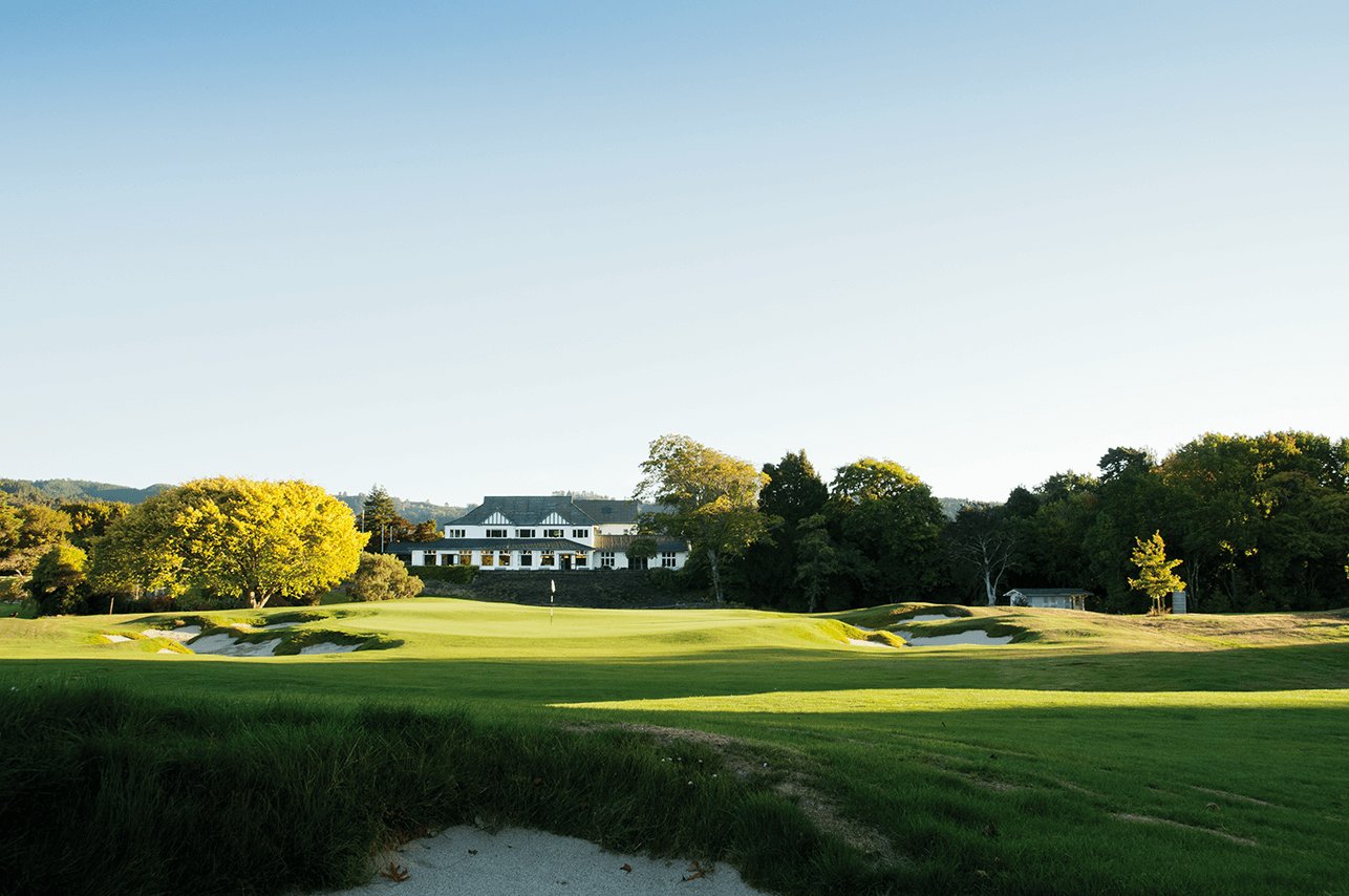 View of the 18th green and clubhouse building at Royal Wellington Golf Club