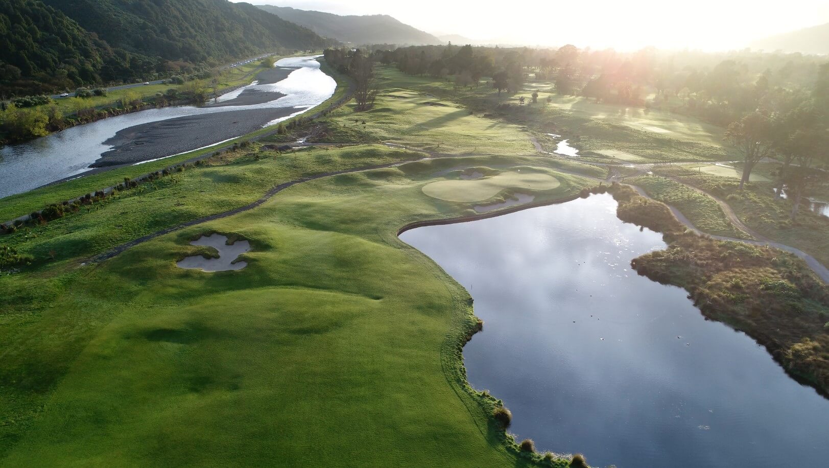 Aerial view over the golf course with an adjacent river at Royal Wellington Golf Club