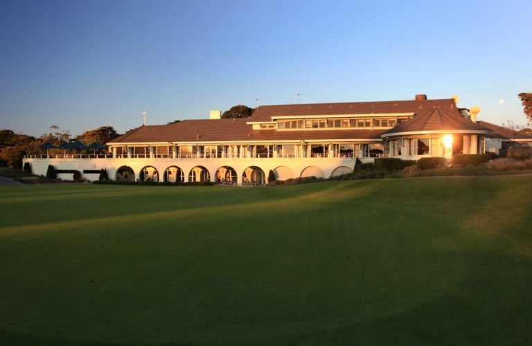The setting sun shines over the Victoria Golf Clubhouse