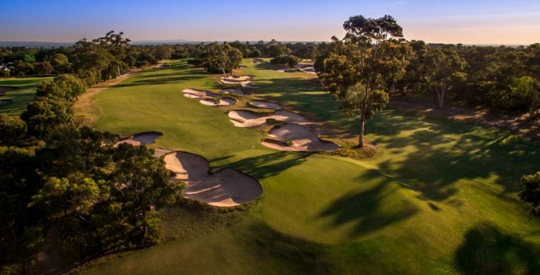 Aerial view of large bunkers leading to a green at Victoria Golf Club in Melbourne