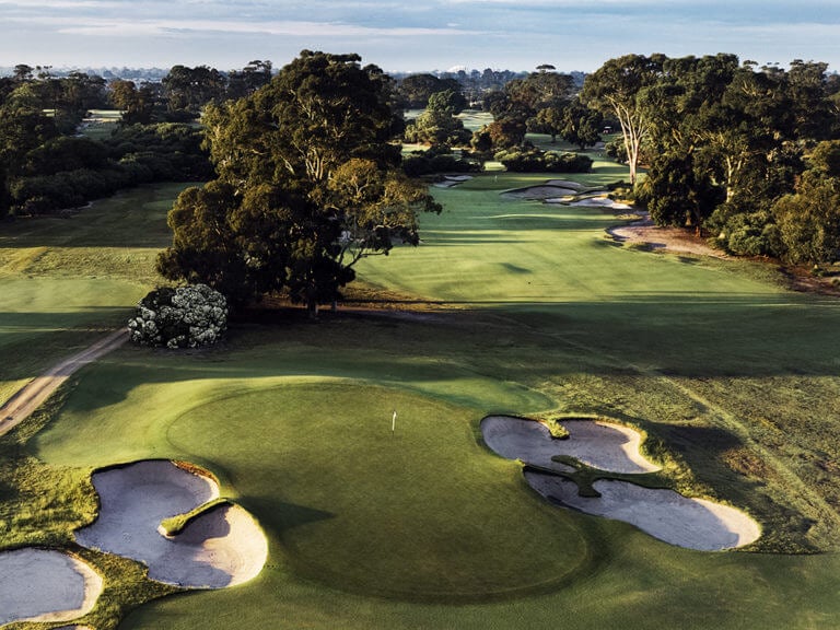 Aerial view of a green lined with bunkers at Victoria Golf Club in Melbourne