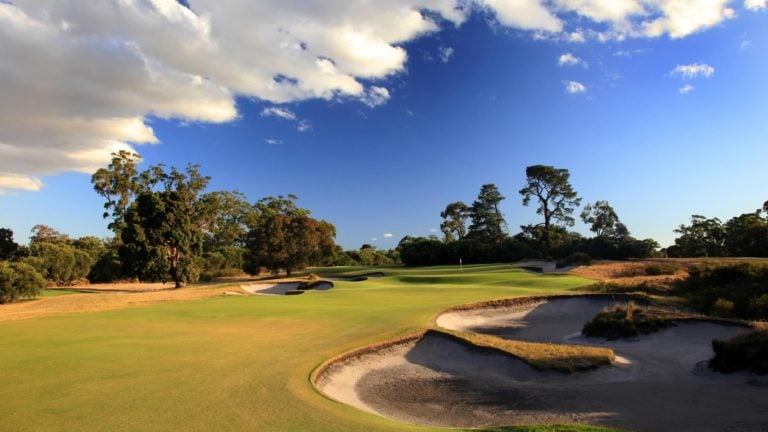 The flat seventh hole is littered with bunkers characteristic of Melbourne's Sandbelt region