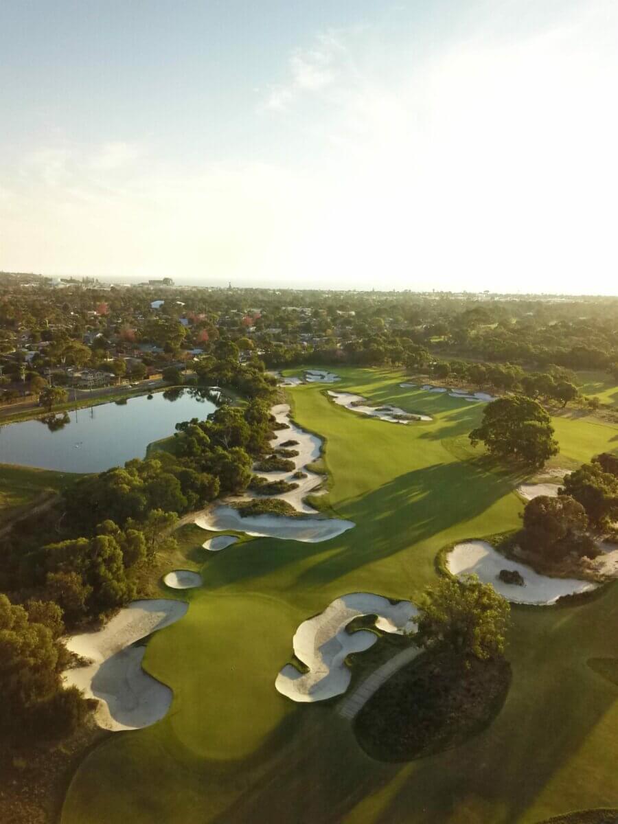 Aerial view of large bunkers surrounding a golf hole at Peninsula Kingswood South Course