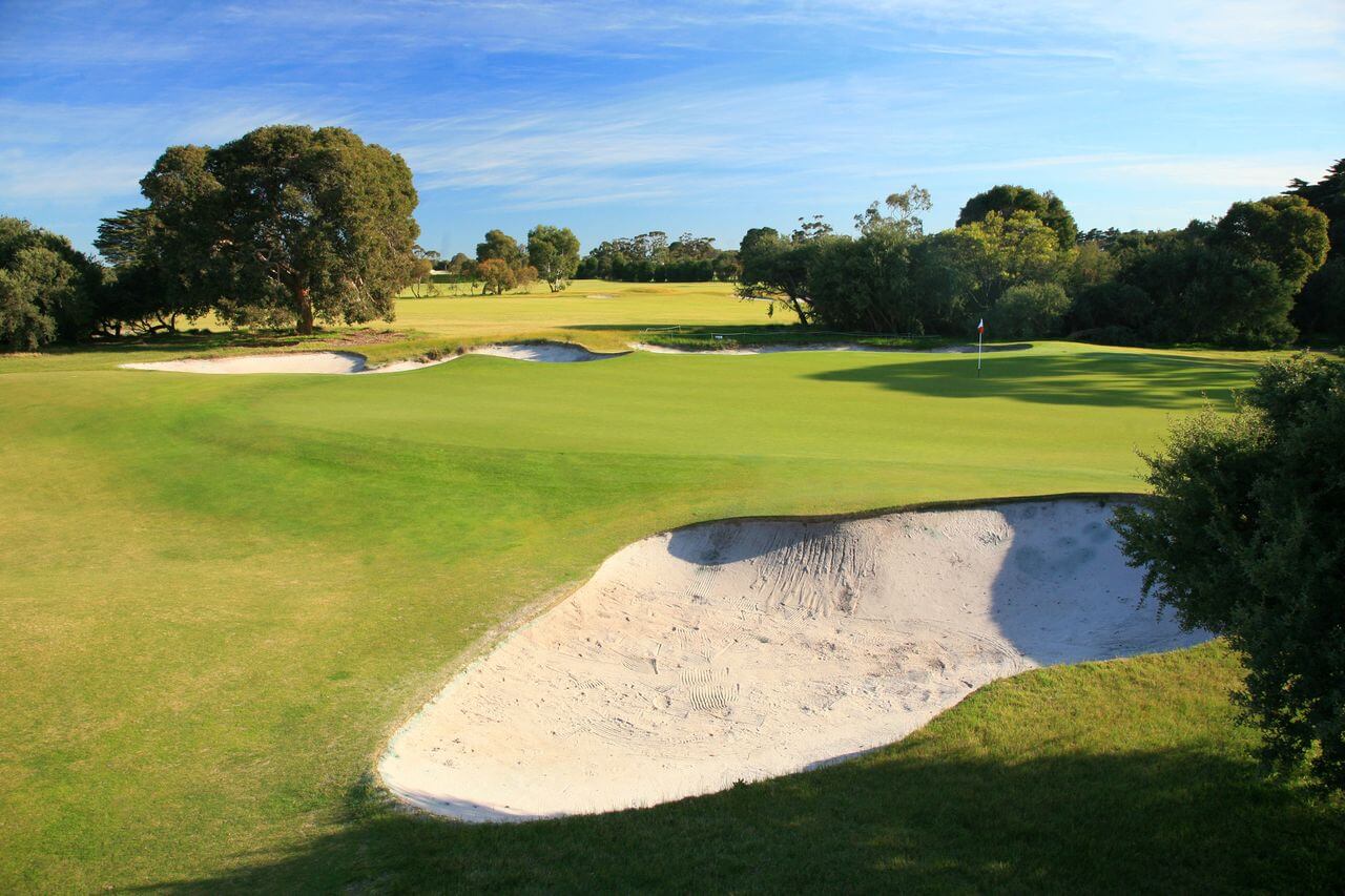 Large sandy bunkers contrast with pure greens at Royal Melbourne Golf Course