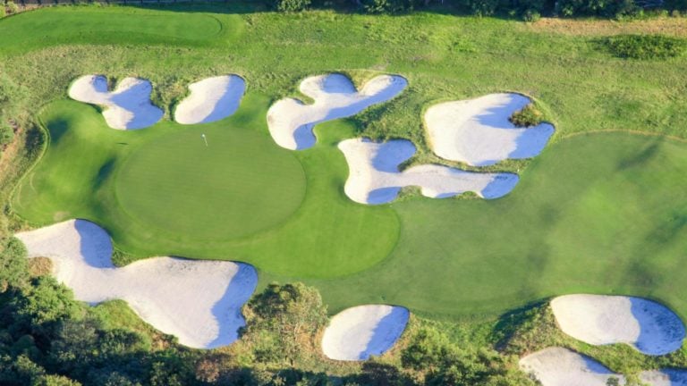 birds-eye-view of numerous bunkers flanking the sixteenth green at Royal Melbourne golf course