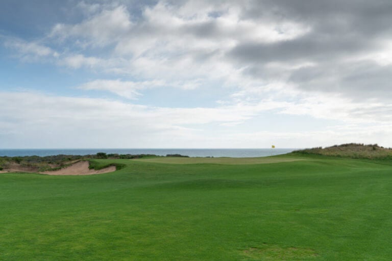 Te sixteenth hole has sea views at The National Golf Club Gunnamatta course