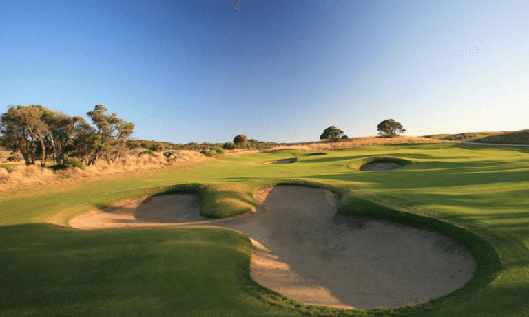 Overlooking large bunkers leading to an uphill green