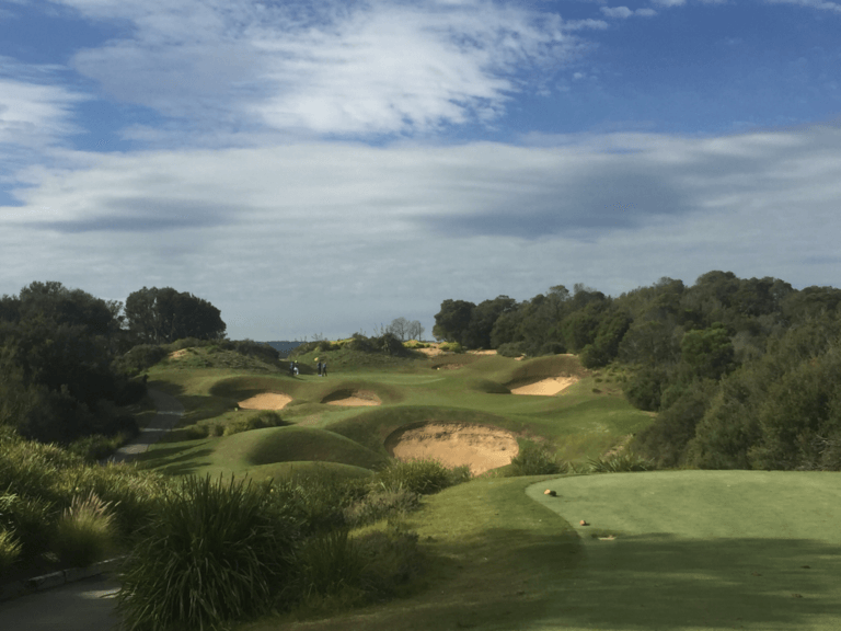 Large bunkers and low valley separate a tee from green at Eagle Ridge Golf Club