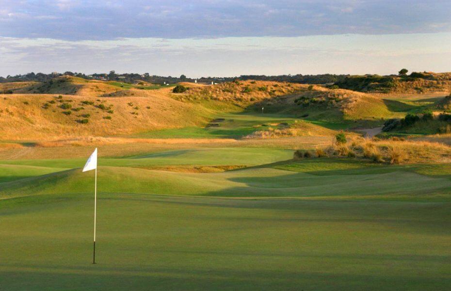 Golden sunset light shines over the Dunes Golf Links