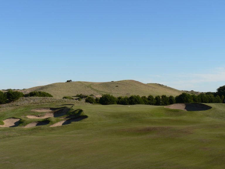 Large bunkers surround the seventeenth green on The Dunes Golf Links
