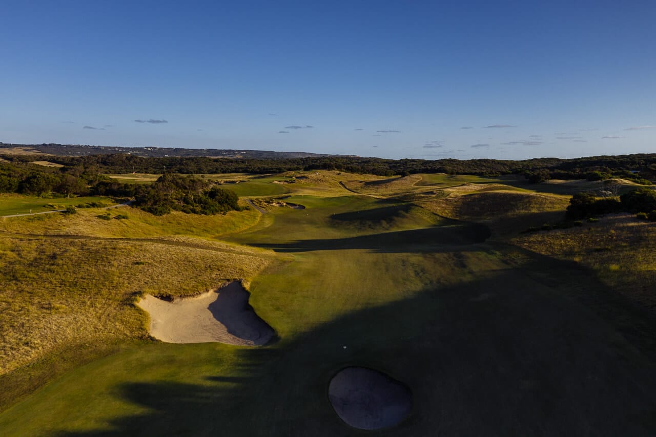 Long shadows cast darkness over wide fairways at St Andrews Beach Golf Club