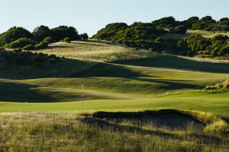Undulating fairways lead to a sloped green at the St Adrews Beach Golf Course