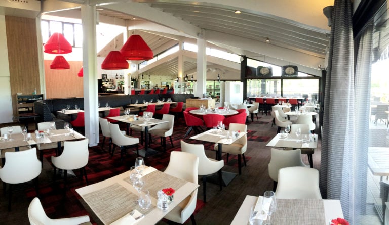 Contemporary clubhouse restaurant with red and white colouring