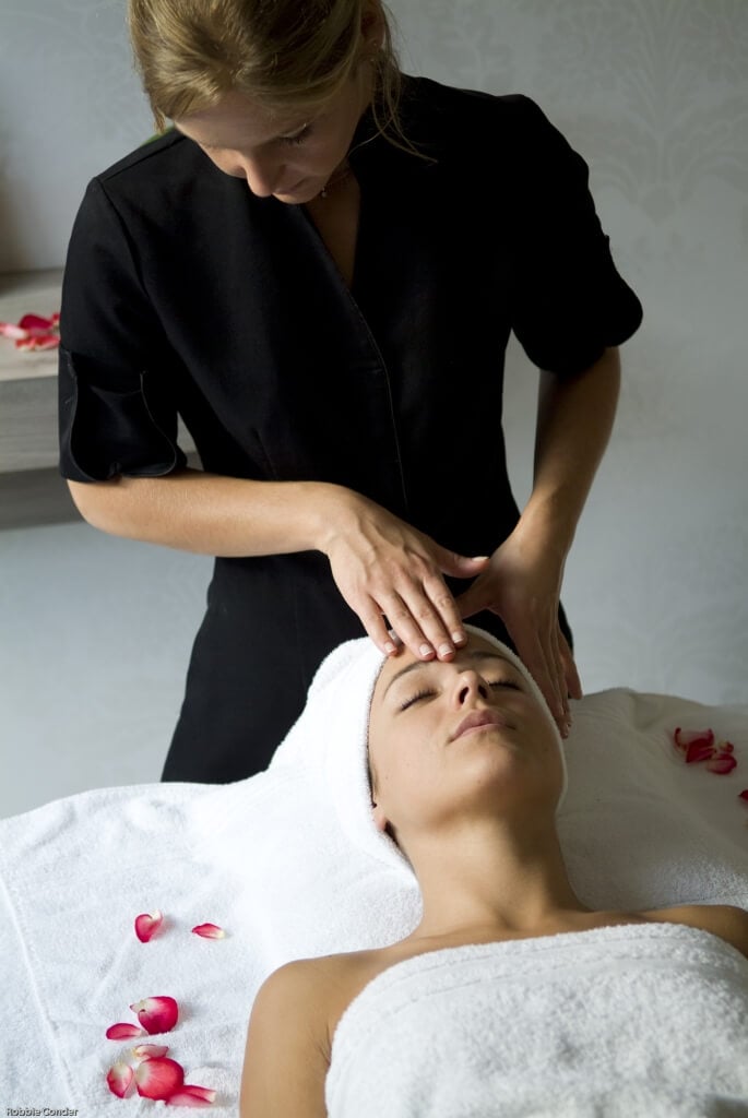 A woman receives a facial treatment at Golf du Medoc Resort