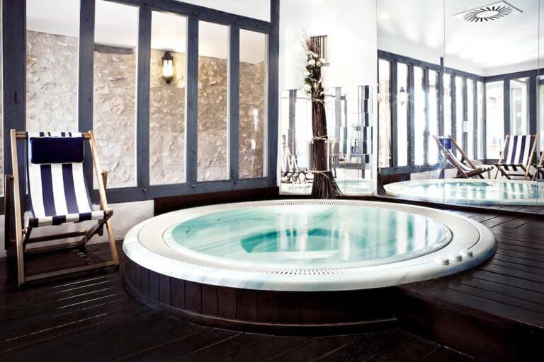 Spacious circular indoor jacuzzi is available to staying guests at Golf du Medoc Resort