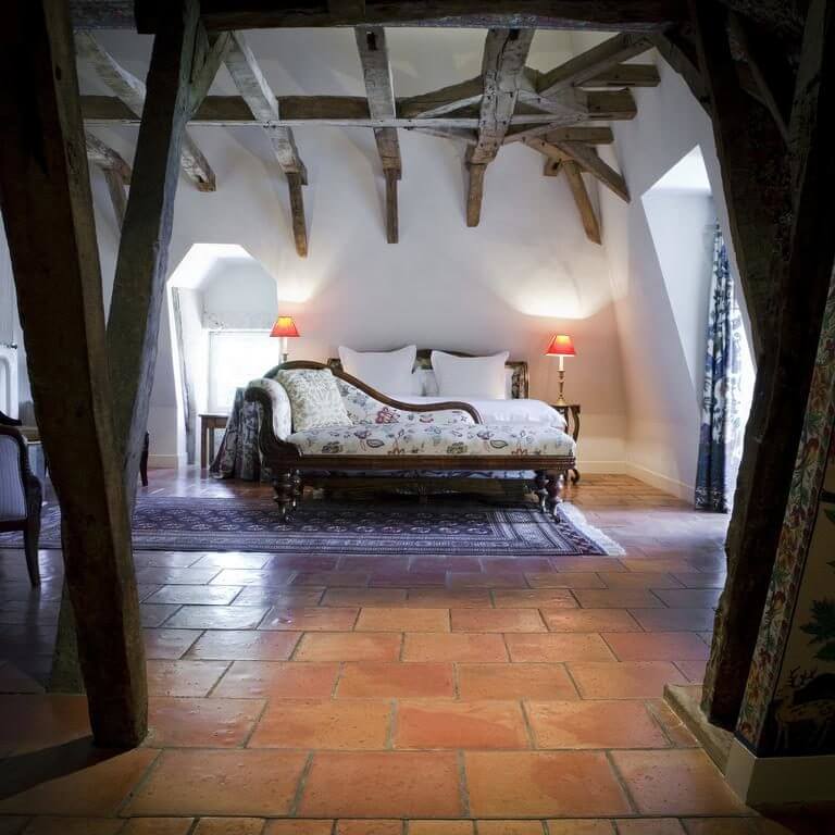 Spanish tiles contrast with wooden beams in the Prestige Suite