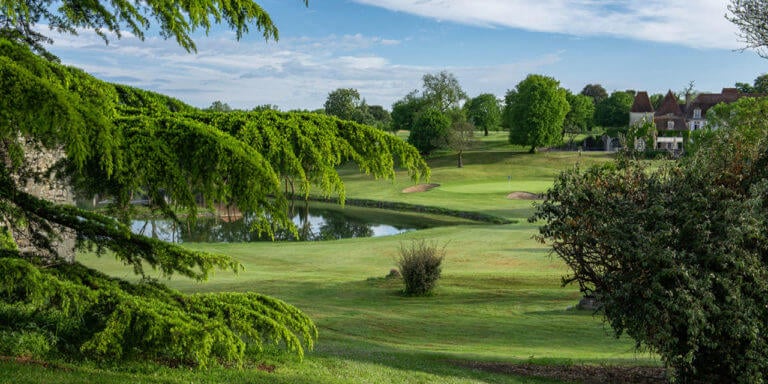 A lake sits adjacent to the eighteenth hole at Chateaux de Vigiers golf course