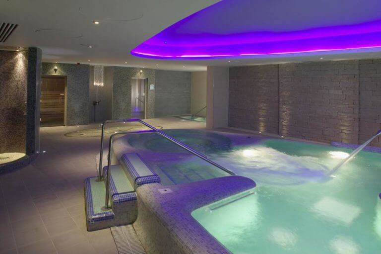 Purple light shines over the indoor jacuzzi at The Old Course Hotel in St Andrews