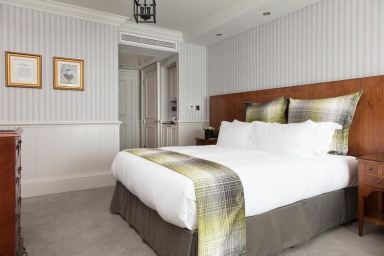 Large double bed and well-appointed room at The Old Course Hotel