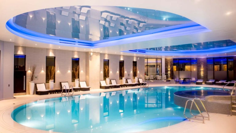 A raised jacuzzi backs onto an indoor pool at Gleneagles Resort