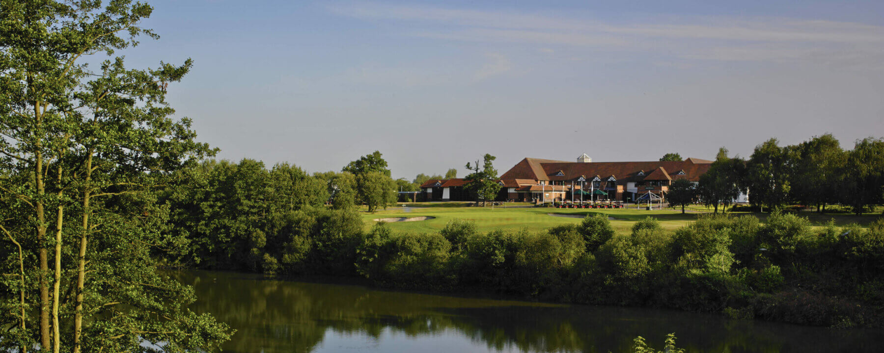 A large dam separates the tee from green on the eighteenth hole