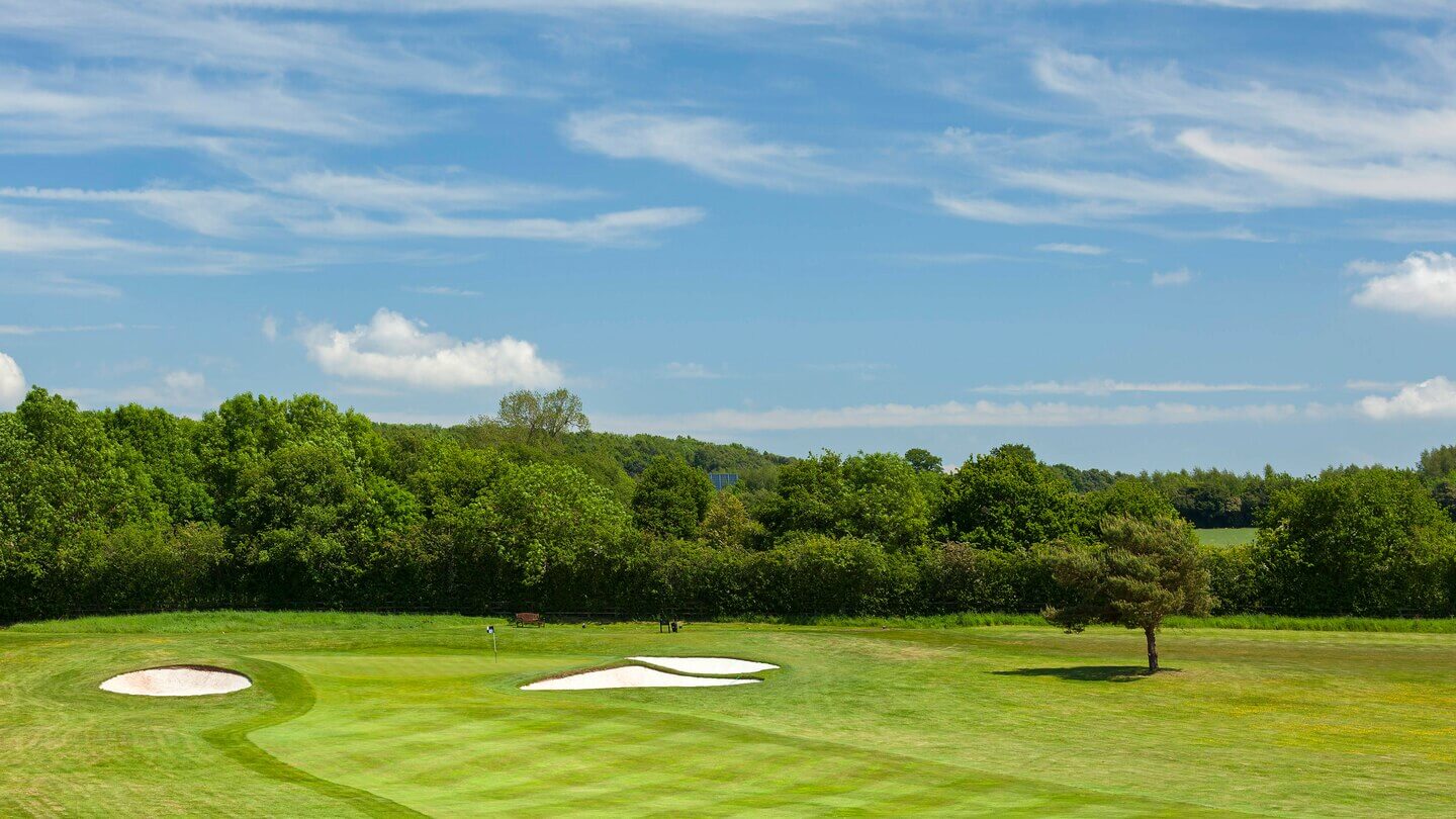 Dense woodlands back onto the resort golf course
