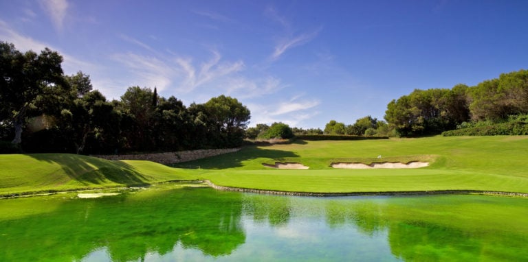Overlooking a lake and natural amphitheatre on the Real club Valderrama Golf Course