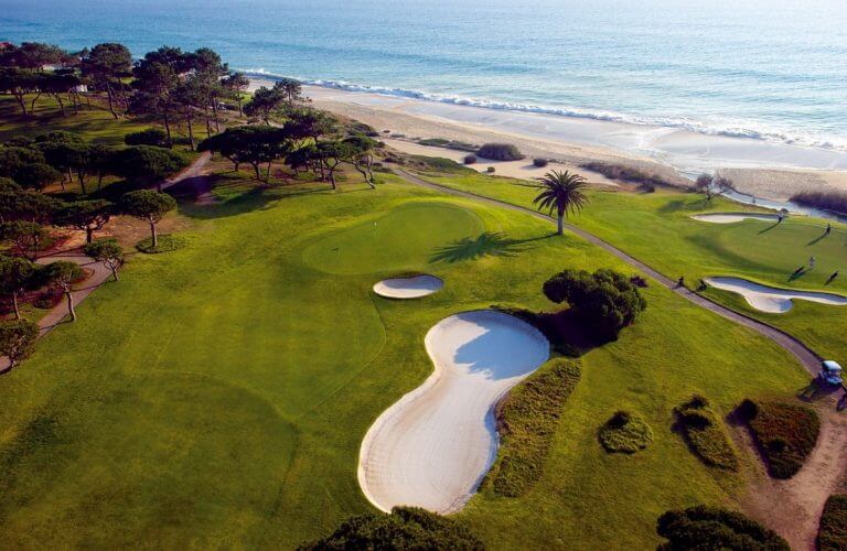 Aerial view of large bunkers guarding the approach to a green at Vale do Lobo Golf Course
