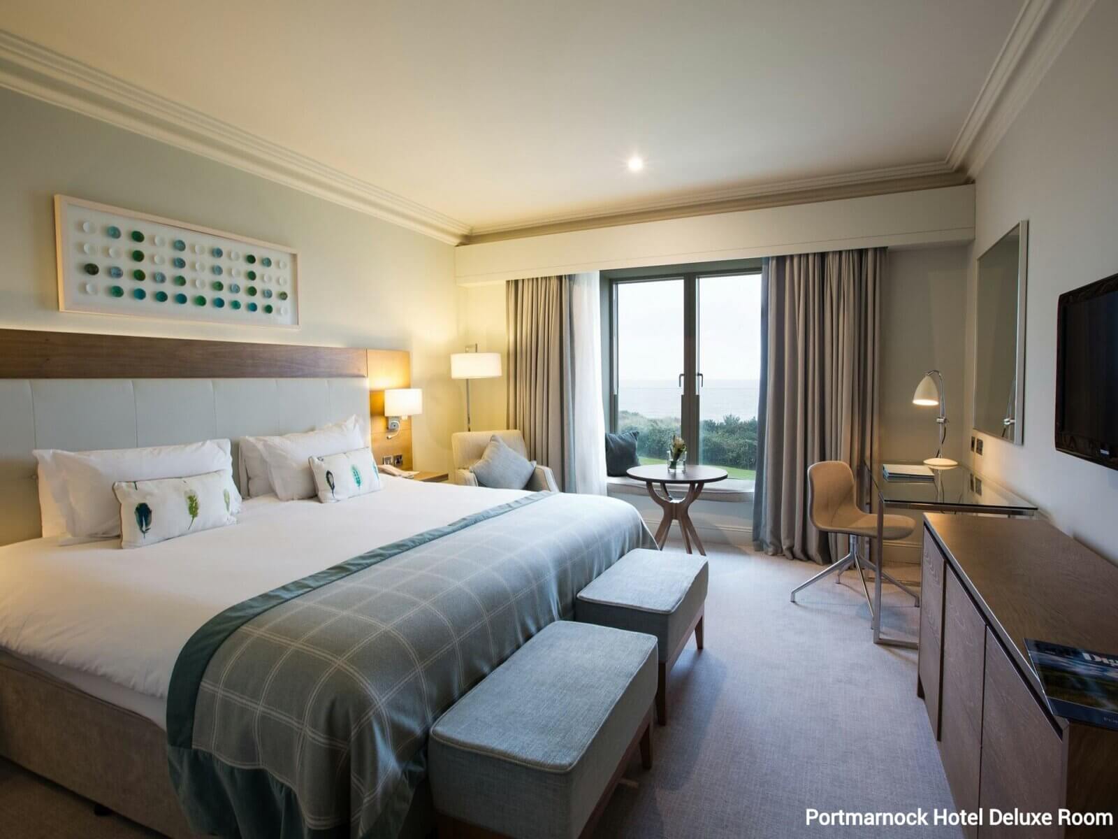 Internal view of a large king bedroom with sea views