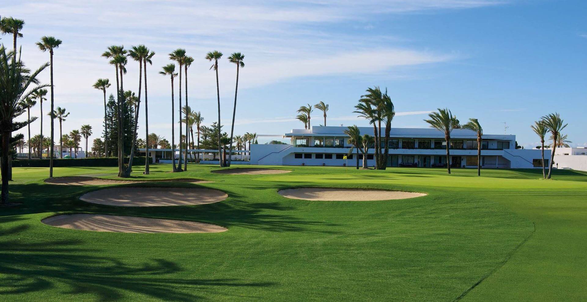 Landscape view of the clubhouse and eighteenth bunkers at Sotogrande