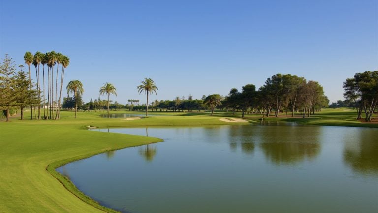 Body of water separates golf holes at Real Club Golf de Sotogrande