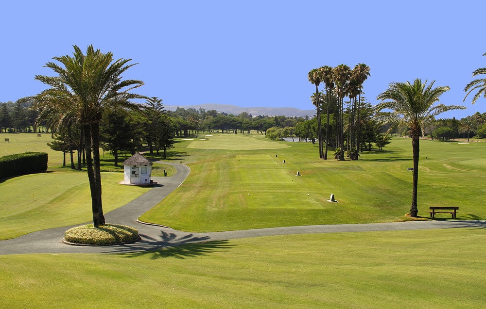 Square tee boxes lead to an open fairway at Sotogrande