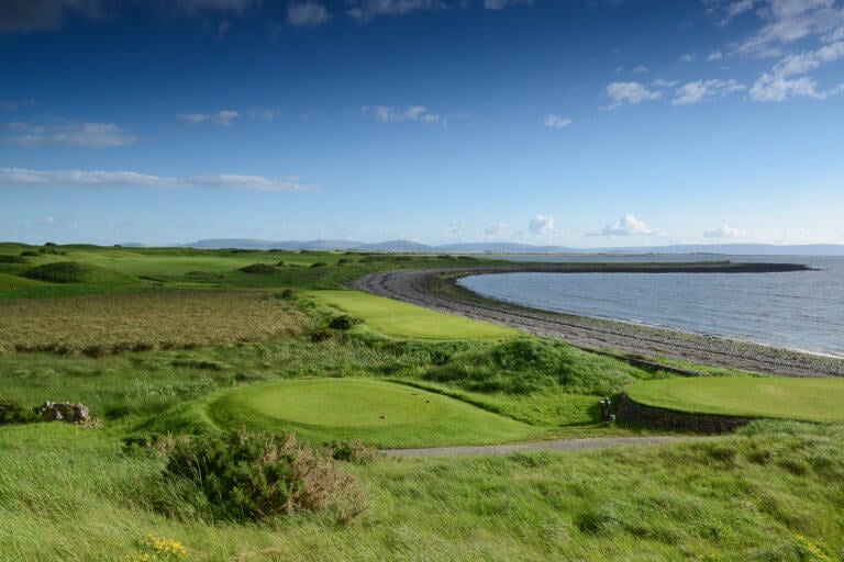 The 14th tee stands above rocky coastline at Galway Bay