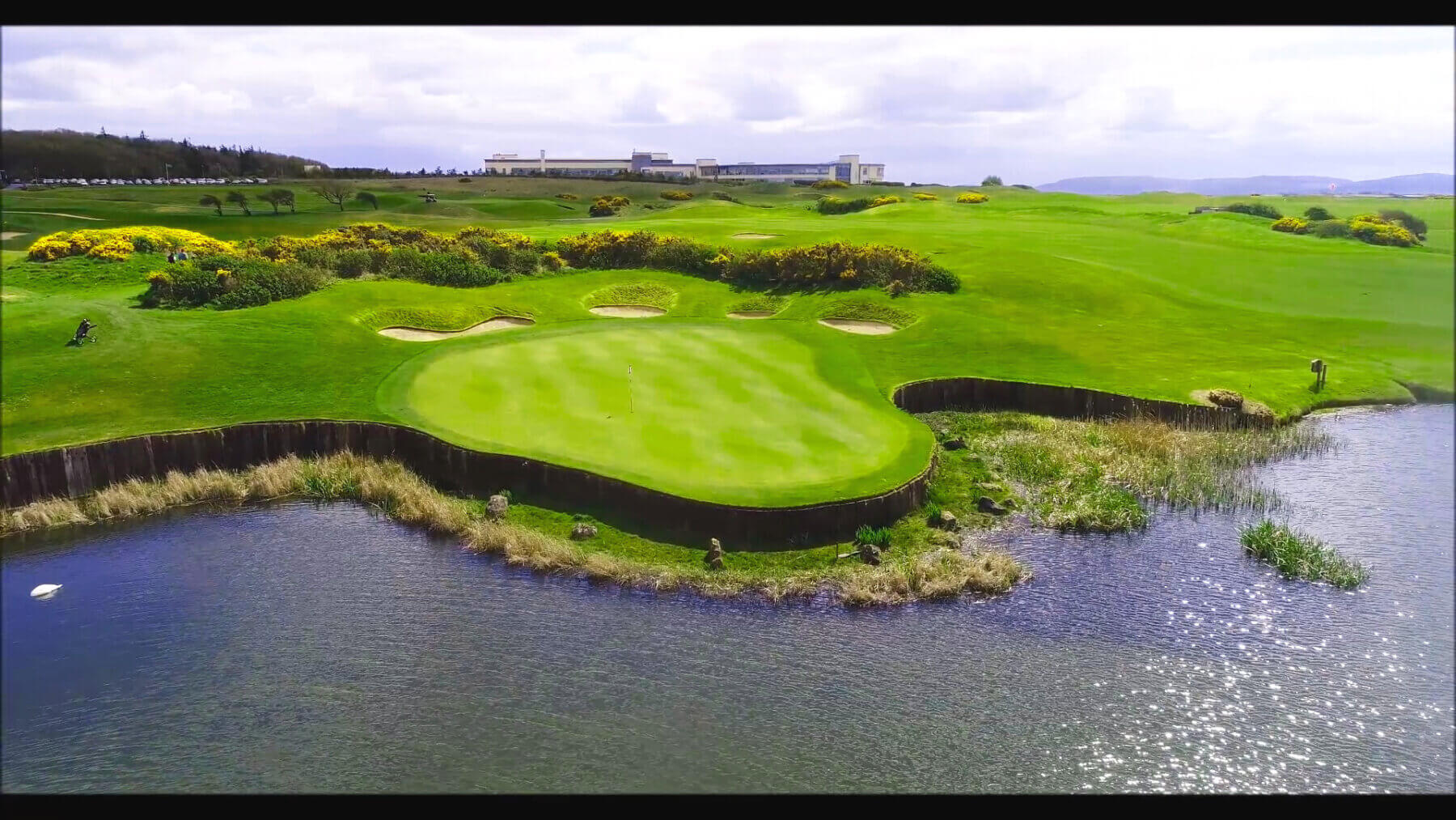 Aerial view of a lake next to the seventh green