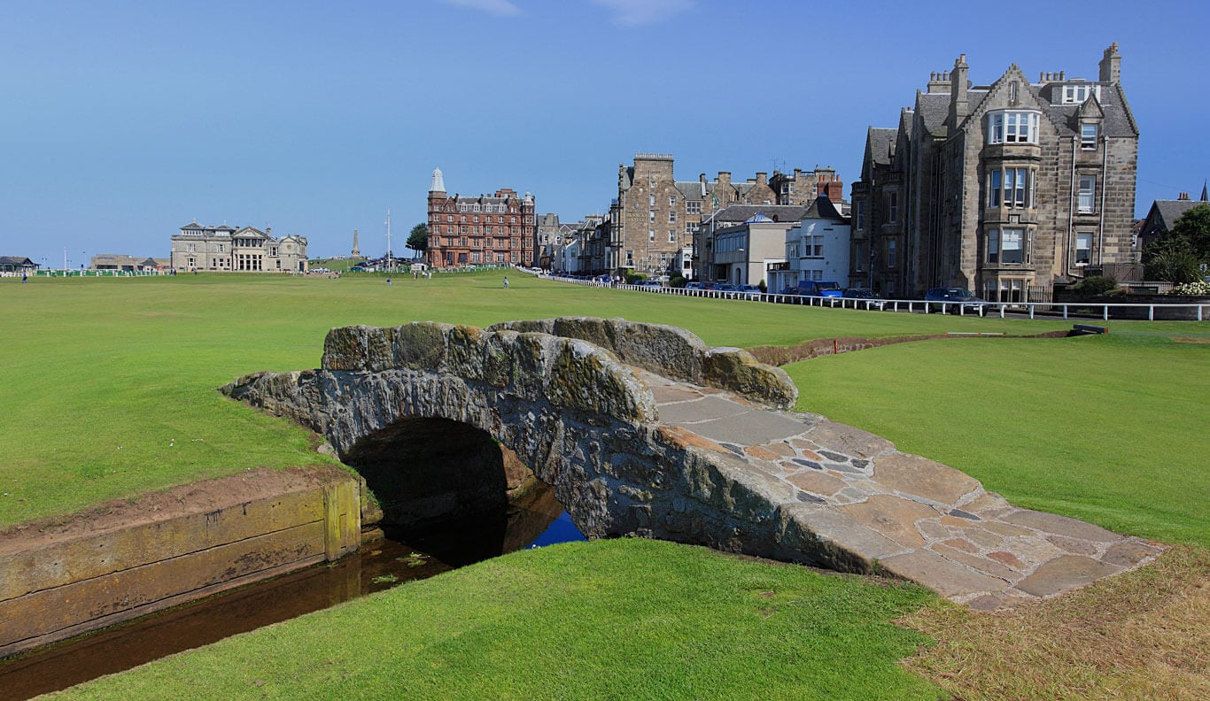 Iconic Swilcan Bridge and St Andrews town buildings