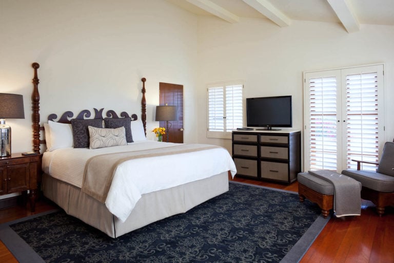 A King bed and TV feature in a Ojai Valley Inn Luxury Room