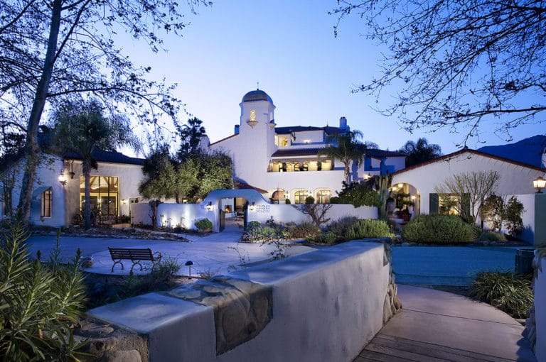 Twilight view of the main spa building at Ojai Valley Inn