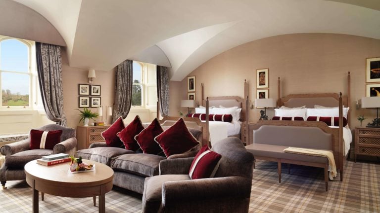 Twin beds and separate sitting area awaits guests at Dromoland Hotel