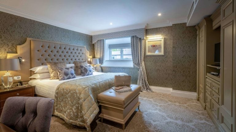 Interior view if a Queen Anne bedroom at Dromoland Hotel