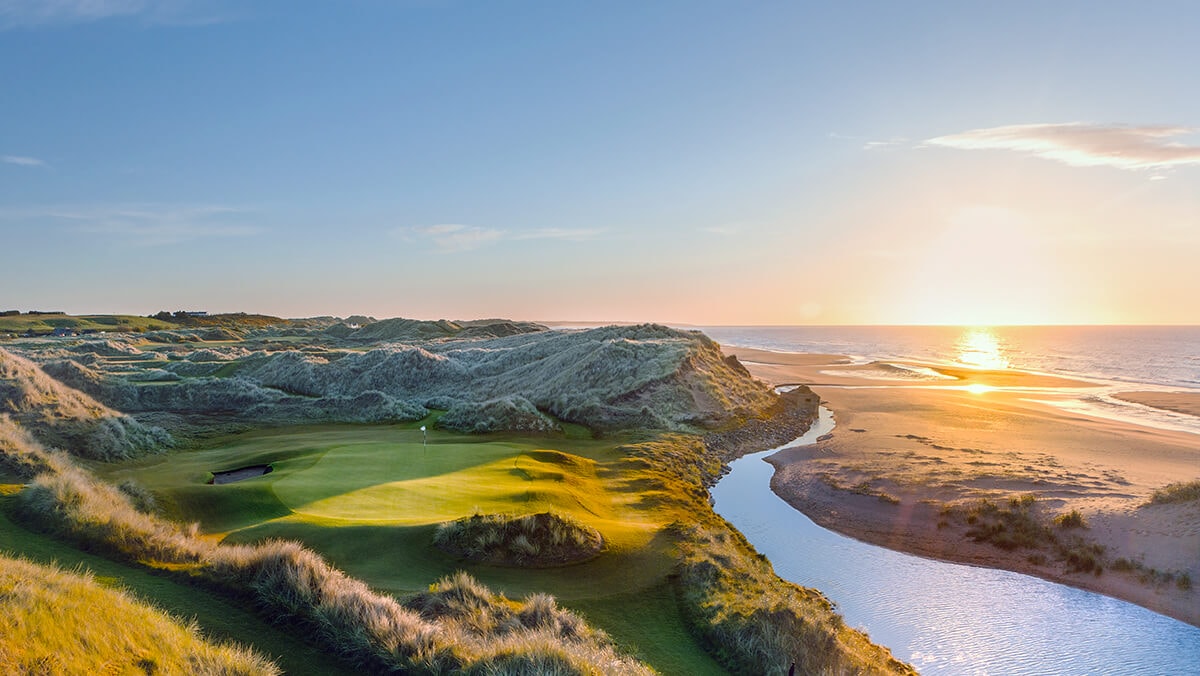 Golden sunlight of dawn shines over the Trump International Golf Links in Scotland