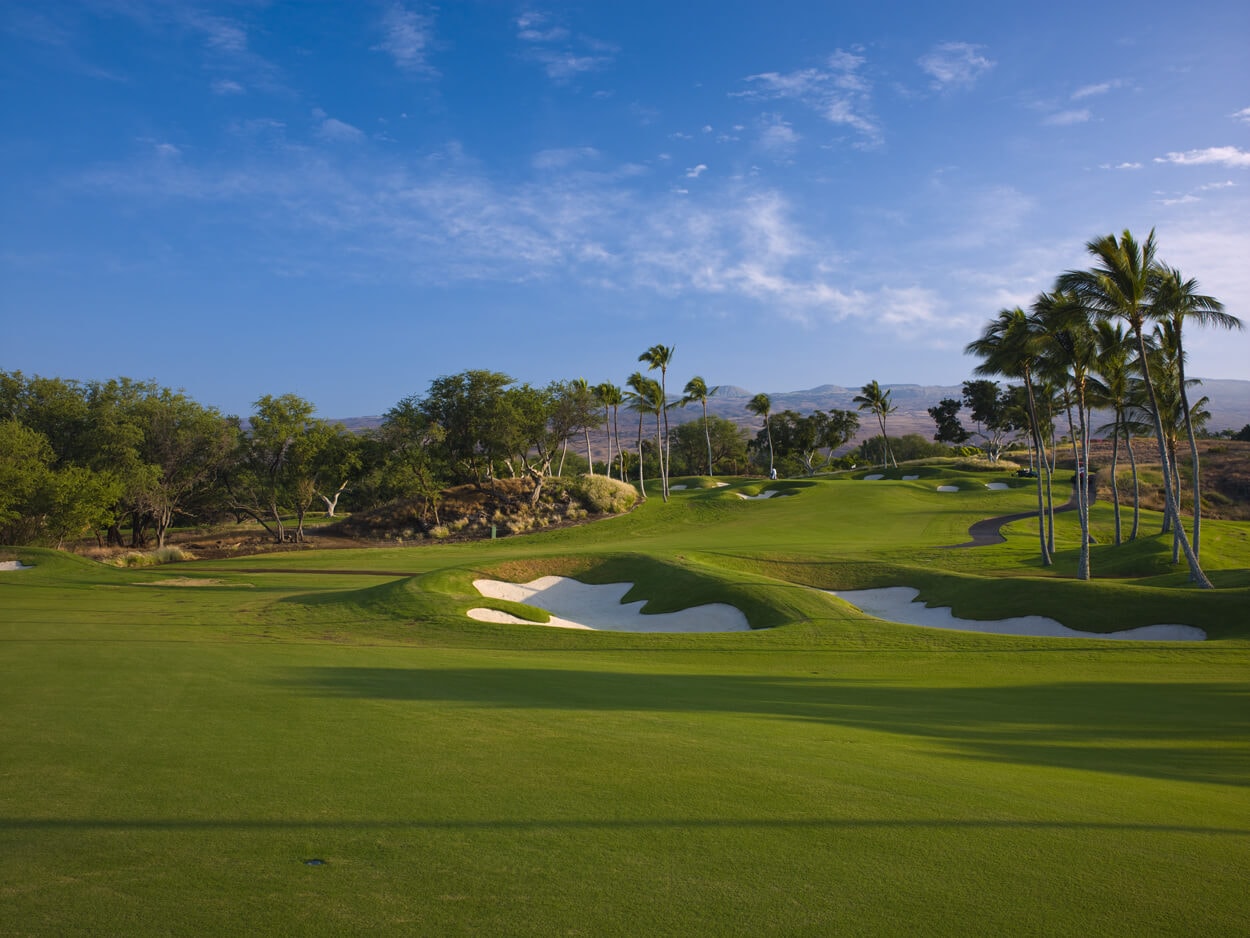 LArge bunkers and raised mounds feature on the Mauna Kea Golf Course in Hawaii