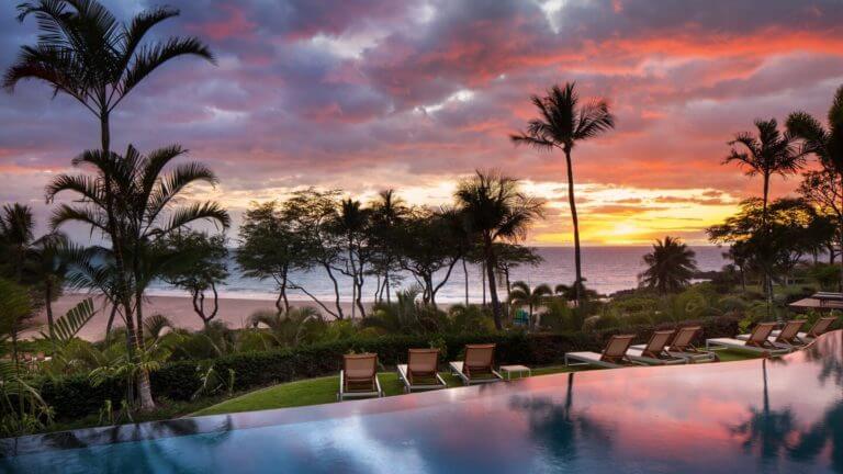Golden light of the setting sun overlooks an infinity pool at the Westin Hapuna Beach Resort