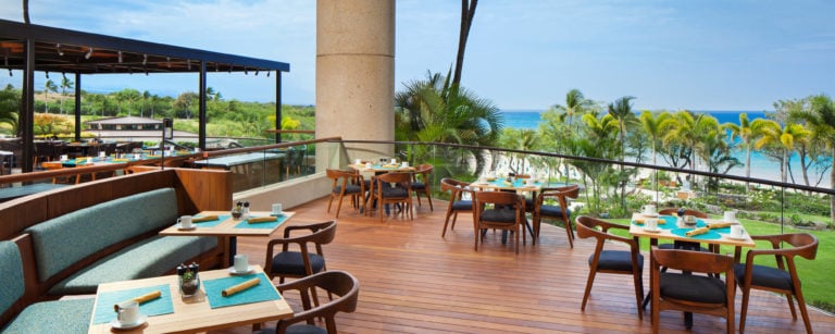 An elevated platform serves as an open-air restaurant at the Westin Hapuna Beach Resort