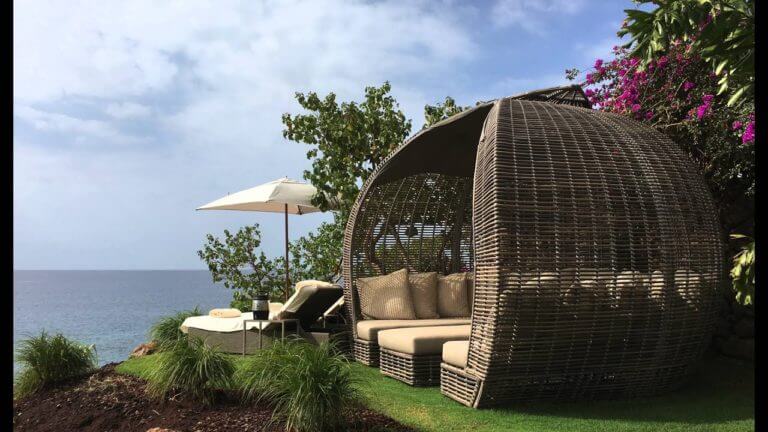 A private cabana allows guests to recline in isolation at Four Seasons Resort