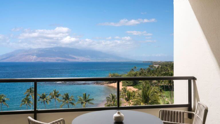 View from a bedroom balcony overlooking the Pacific Ocean and distant island of Lanai