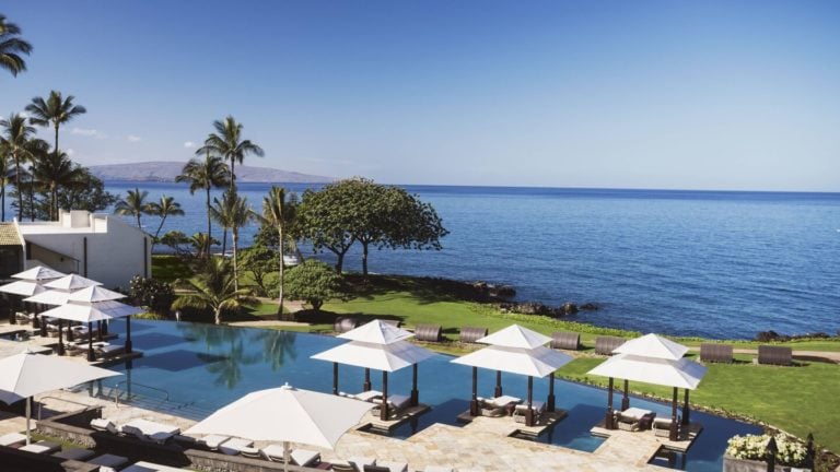 Poolside cabanas overlook the Pacific Ocean in Maui Wailea Beach Resort